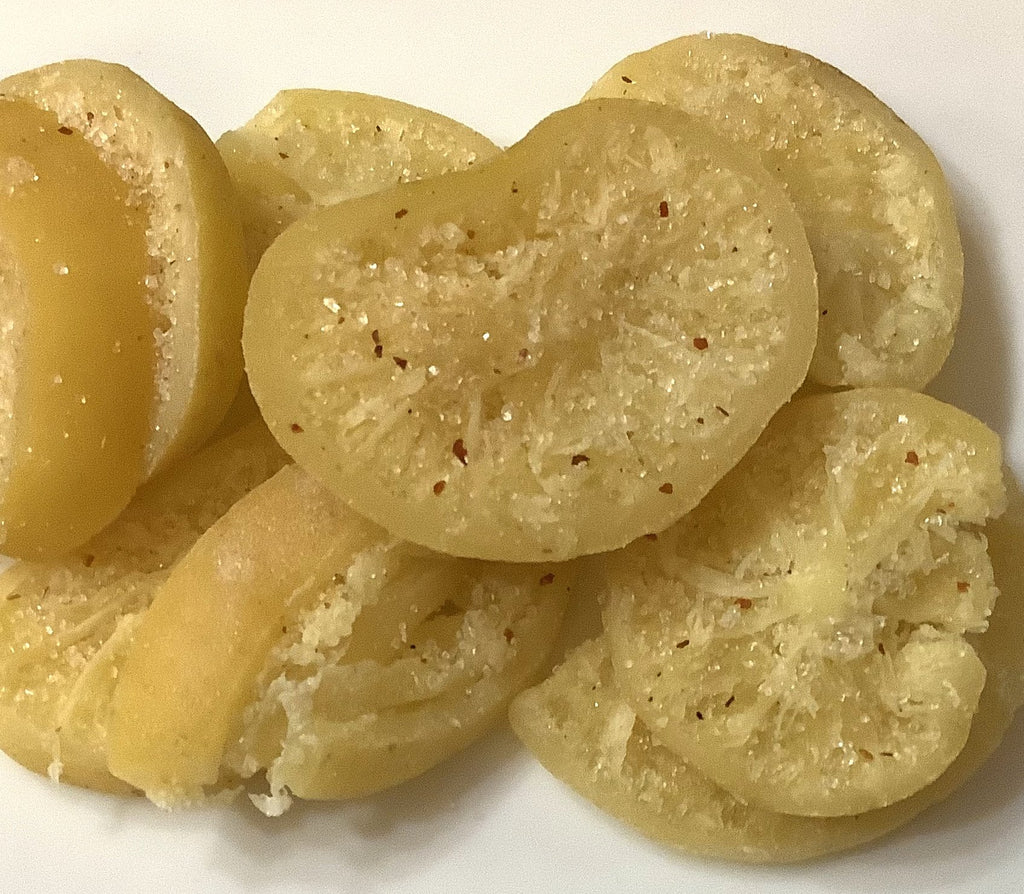 Whole lemon dehydrated and sliced with hint of sweet and spicy sprinkle for a very exotic flavor burst.  Ingredients: lemon, sugar, citric acid, salt, chili, sulfur dioxide Product of Thailand