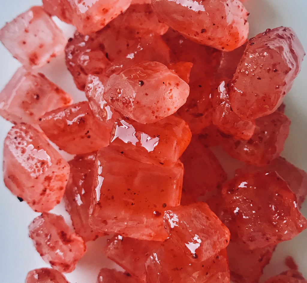 Rock candy coated with Li hing juice and Li hing powder.  Ingredients: Pure cane sugar, natural and artificial flavor and coloring (FD&C red #3, #40, yellow #5 & blue #1) Li Hing Powder (plum, salt, sugar, saccharin, licorice.) 